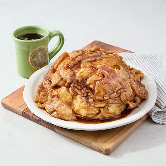 Apple Pancake Original Pancake House served with coffee on wooden board